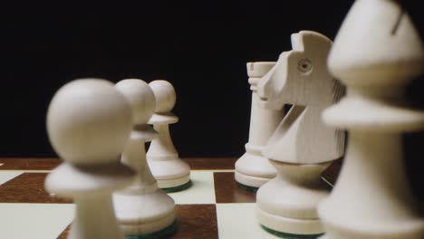 close-up of white chess pieces on a chessboard