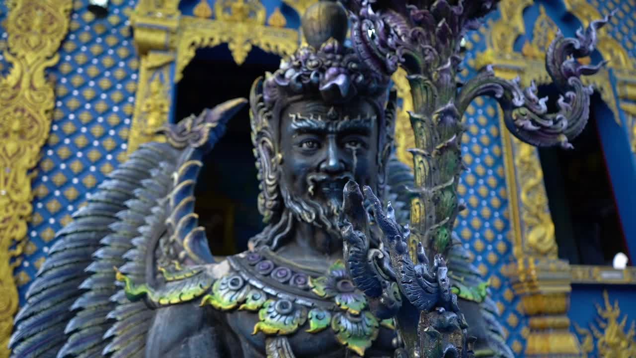 Close up at a statue face at Wat Rong Sear Tean (Blue Temple). Chiang Rai, Thailand.