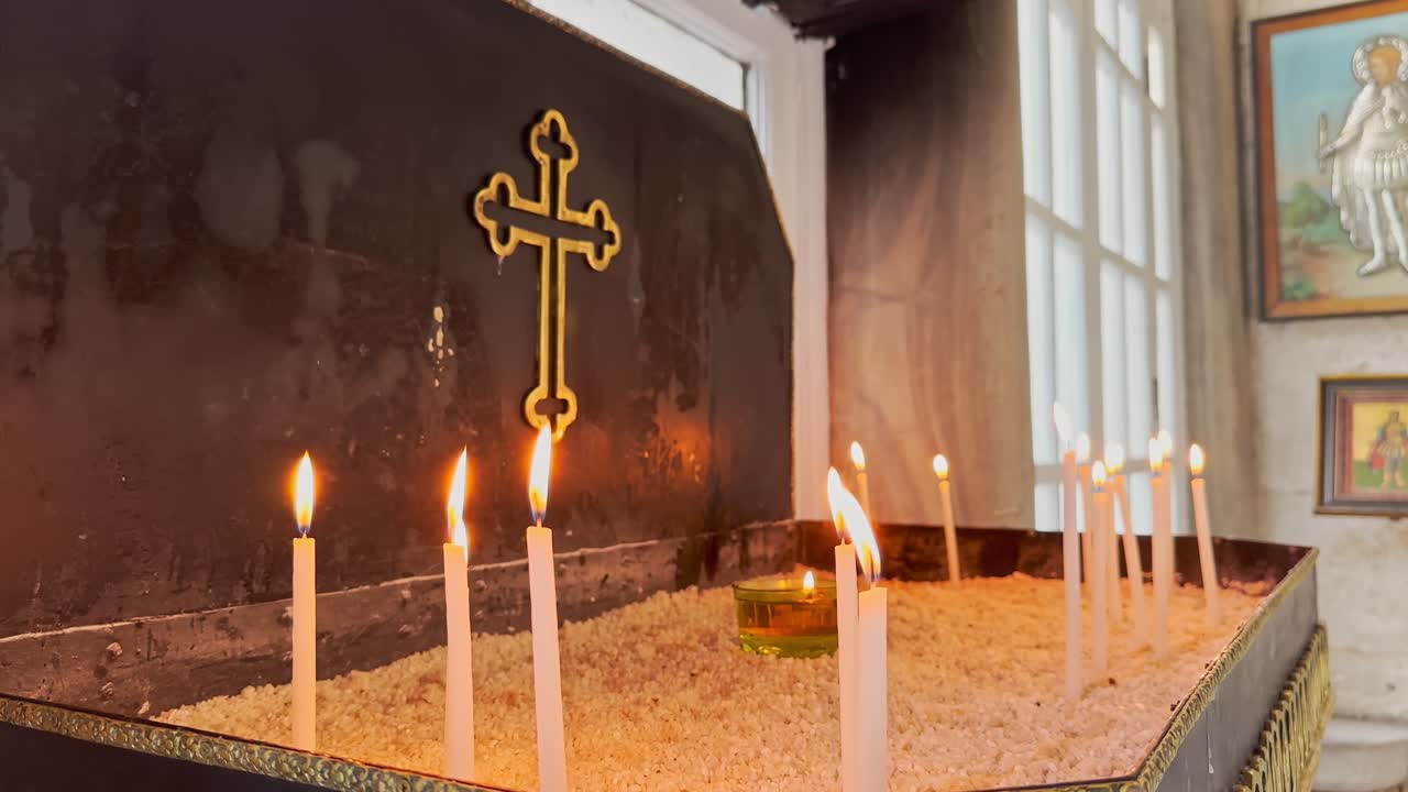 prayer, candle, cross in historical church