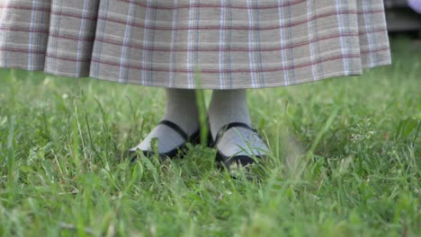 Woman-in-Folk-Costume-Sweeping-With-a-Handmade-Broom-in-Slow-Motion