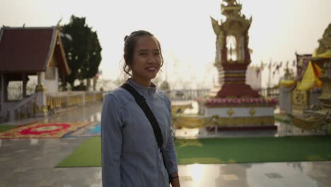 woman at a buddhist temple in thailand