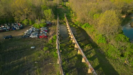 aerial view of junk yard with stacks of used cars in fayetteville, arkansas, usa