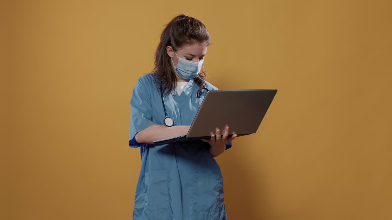 Nurse working on laptop