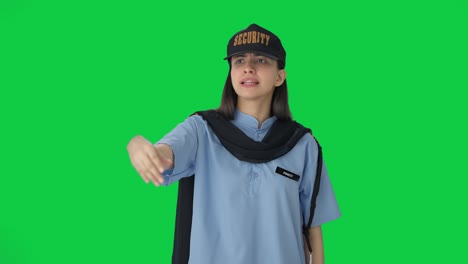 Angry-Indian-female-security-guard-blowing-whistle-Green-screen