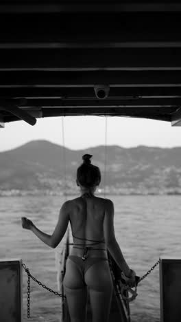 woman in bikini on a boat pier