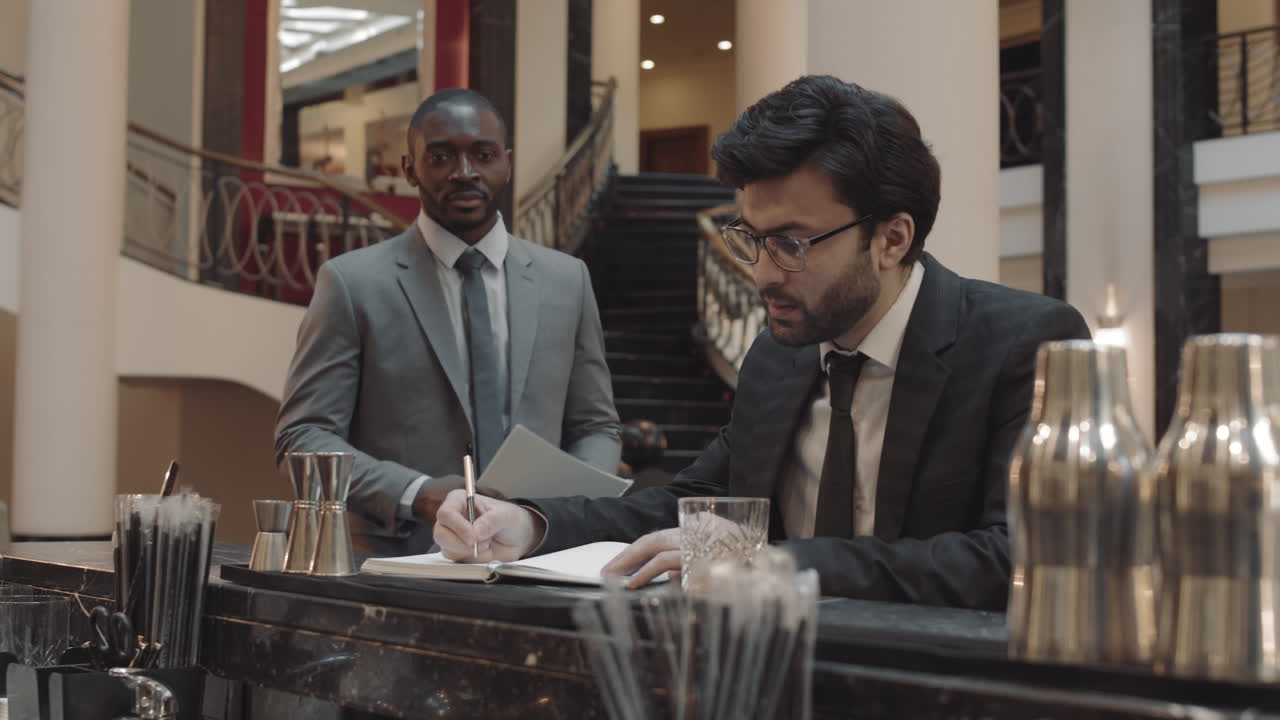Business Partners Meeting by Bar Counter