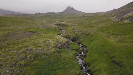 aerial footage of waterfall during cloudy summer in olafsvik, snaefellsness peninsula, iceland