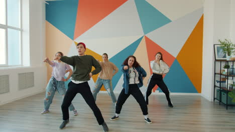 teenagers performing hip hop dance in a studio