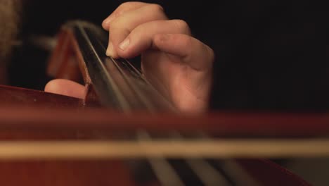 close-up-of-cello,-cello-bow-,-cello-playing-and-strings