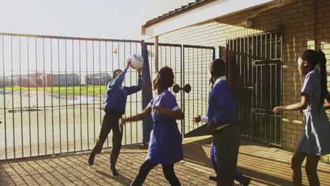 schoolchildren playing in the playground at a township school 4k