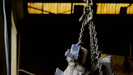 Worker-using-overhead-crane-in-workshop-4k