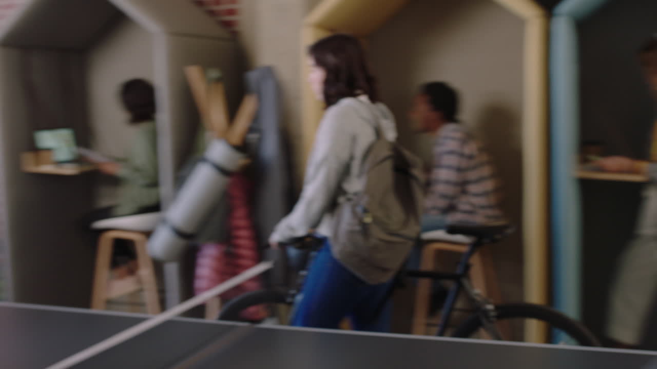 happy business people playing ping pong together in office team leader woman using laptop computer sharing creative ideas colleagues collaborating enjoying creative teamwork