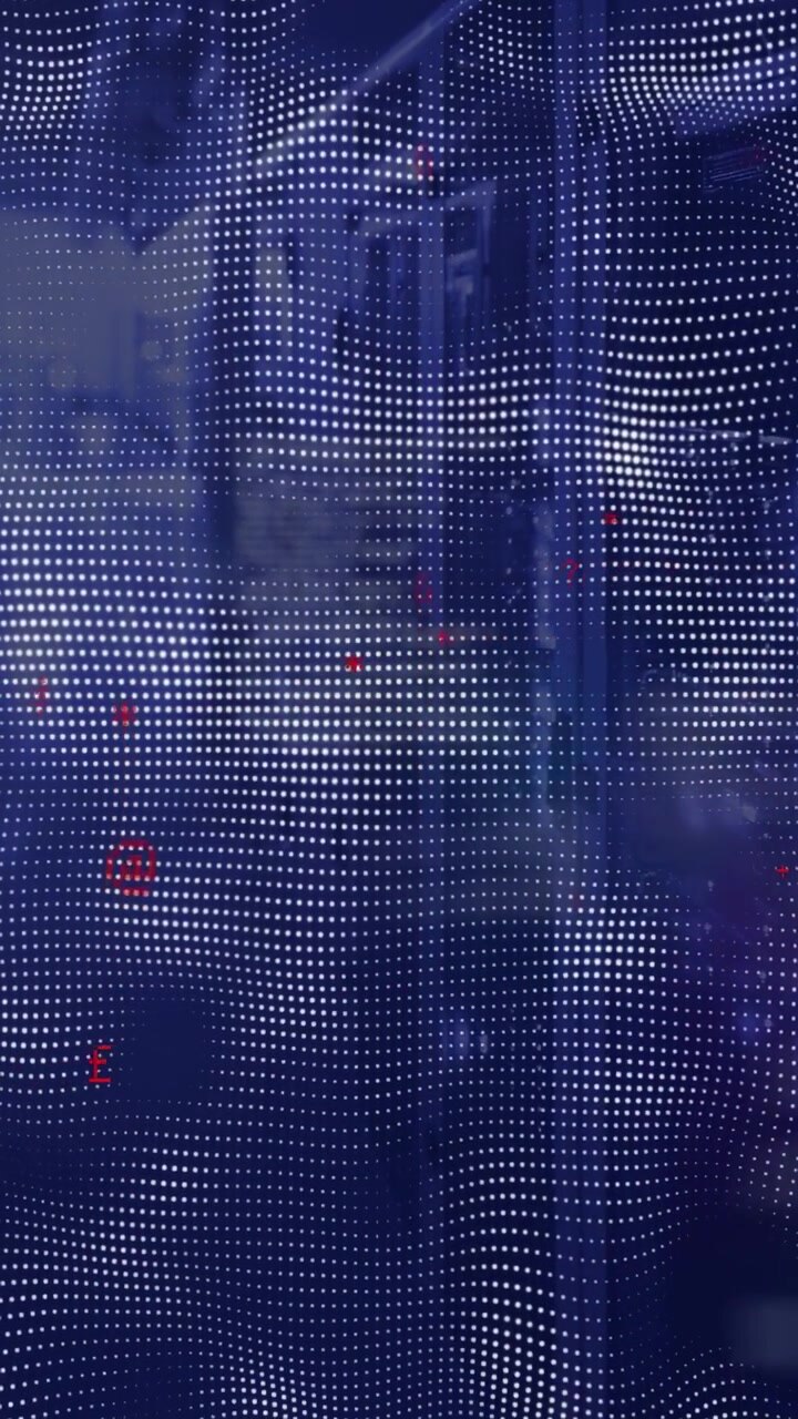Vertical video: Camera pulling back, LED mesh rippling, revealing server racks showing status LEDs