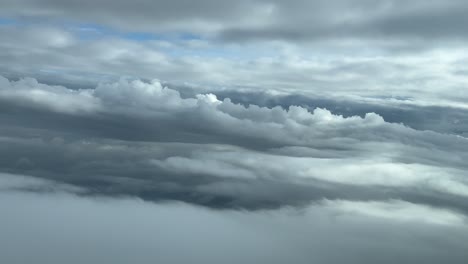 a pilot’s perspective while flying through a dramatic winter sky during a left turn