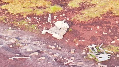 drone view of scattered wreckage debris of the b-29 superfortress wwii plane, on moorland terrain in the peak district, england.