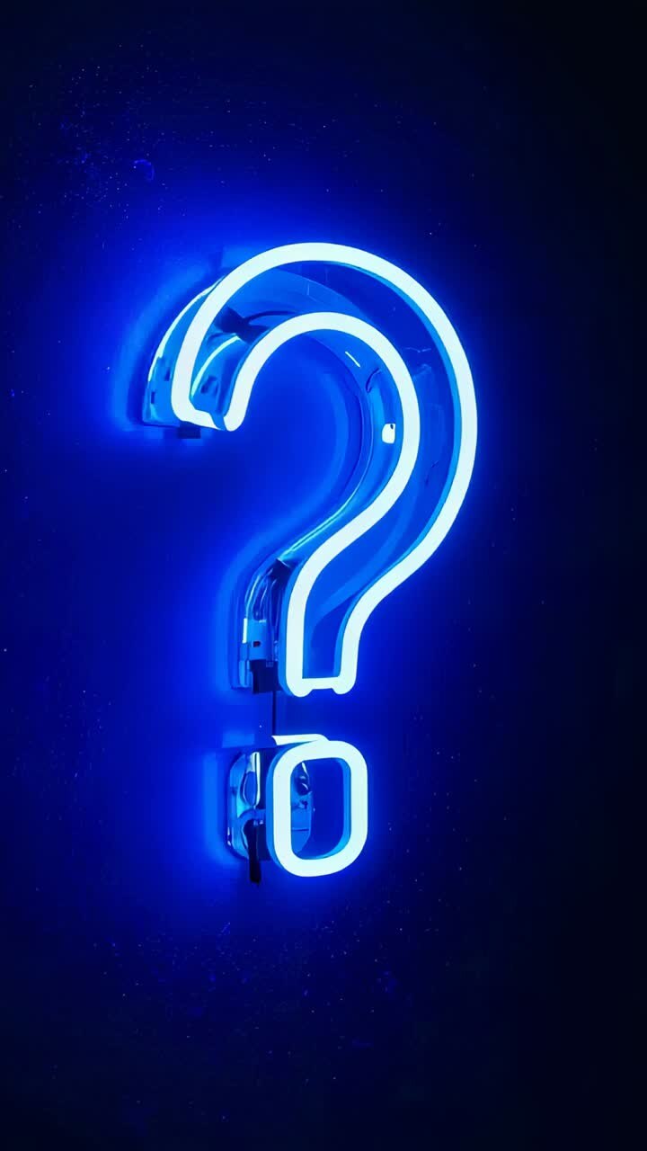 Vertical video: Receiving power, blue neon question mark sign glowing on dark wall, showing wiring