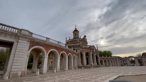spectacular shot of the church of san antonio de padua in aranjuez and its majestic porticos, built in the 18th century in late baroque style with neoclassical elements against a sky with clouds.