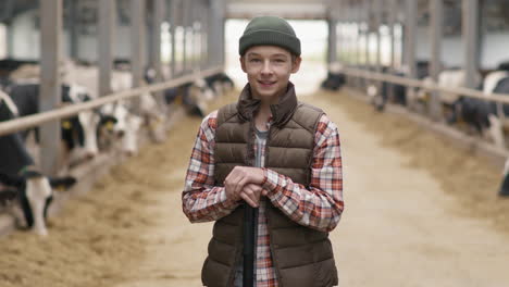 portrait of 15-year-old boy at dairy farm