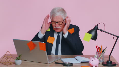 tired exhausted senior business man office manager with laptop sticky notes sticks with many tasks