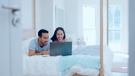 Couple,-laptop-and-talking-on-bed-for-love
