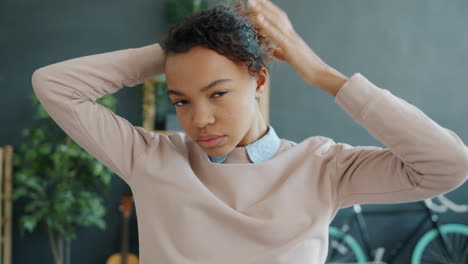 teenage girl adjusting her hair