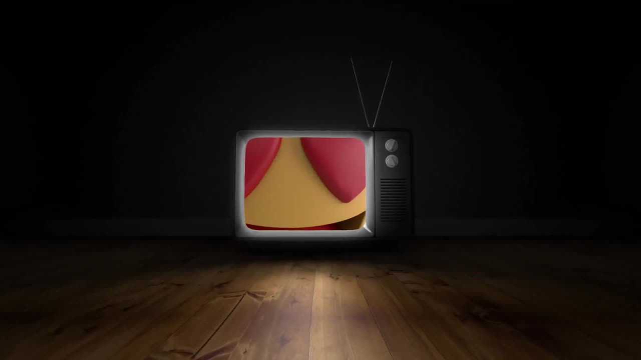 회색 배경을 배경으로 텔레비전 화면에 심장 눈 얼굴 이모티콘