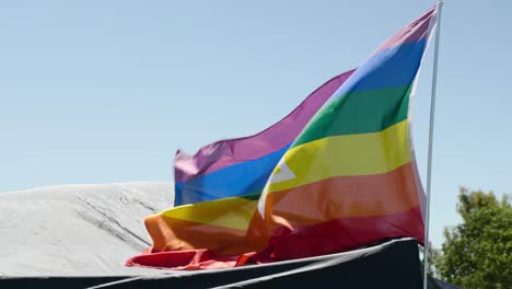 a video shows a tent with a flag flying over it. the flag was basically in multi color and had a star sign in the middle