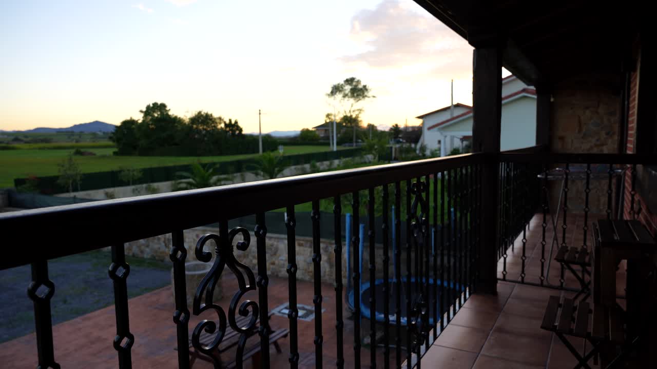 Charming countryside balcony at sunset with peaceful views of Galizano in Cantabria