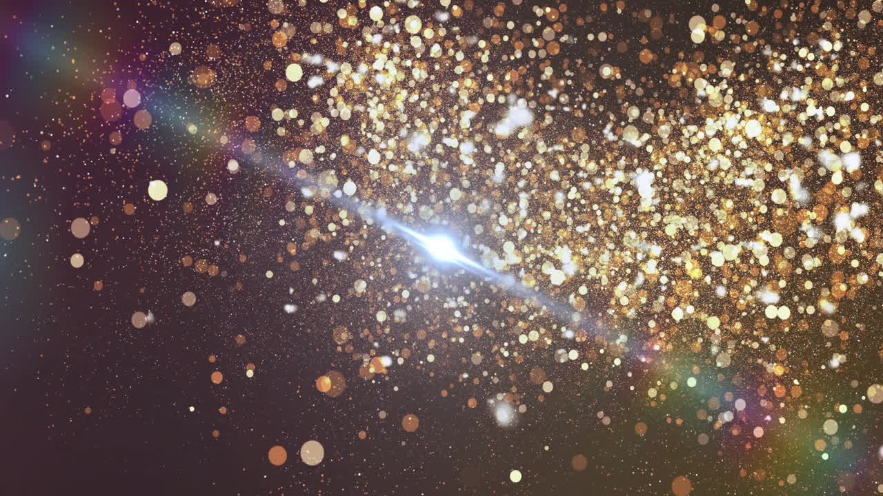 Golden glitter particles under bright light beam in dark space creating animation