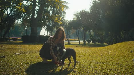 woman and dog in park