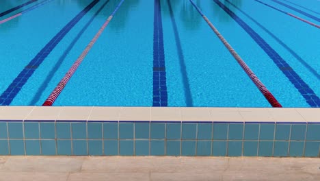 olympic swimming pool background on a bright sunny day