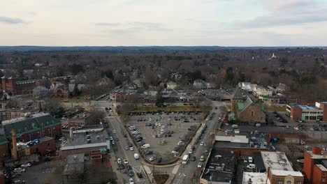 aerial shot flying over a parking lot in a suburb of boston, massachusetts