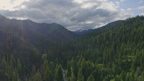 teanaway forest washington aerial v4 dolly in shot of sunrays over cascade mountains and wild forest - june 2020