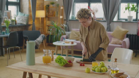 girl with prosthetic arm cooking salad at home