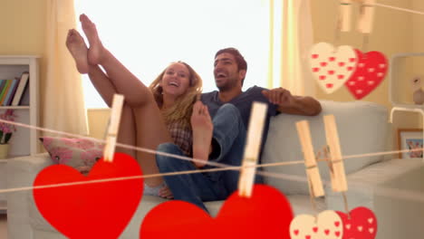 pareja saltando juntos en un sofá