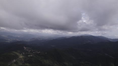 fascinating-video-shot-over-the-flying-pines-of-the-Bracco-pass-in-Italy,-in-the-background-the-sea-and-the-Deiva-marina-beach