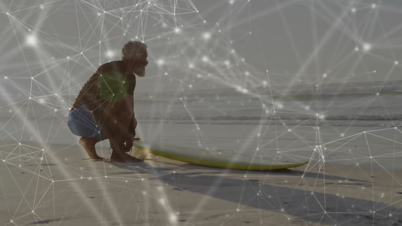 Surfer preparing board on beach with network of connections animation overlay