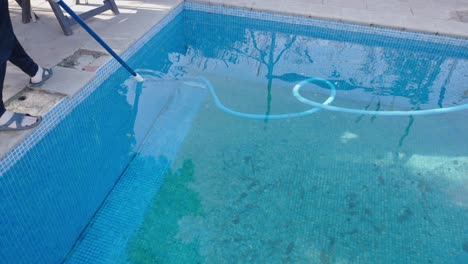 cleaning a dirty swimming pool