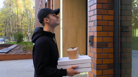 delivery man ringing on the entrance