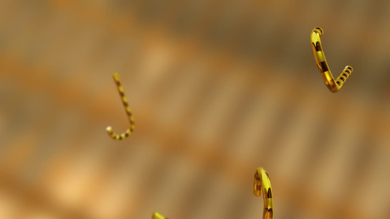 animación de las cañas de caramelo de oro de navidad cayendo sobre el fondo dorado.