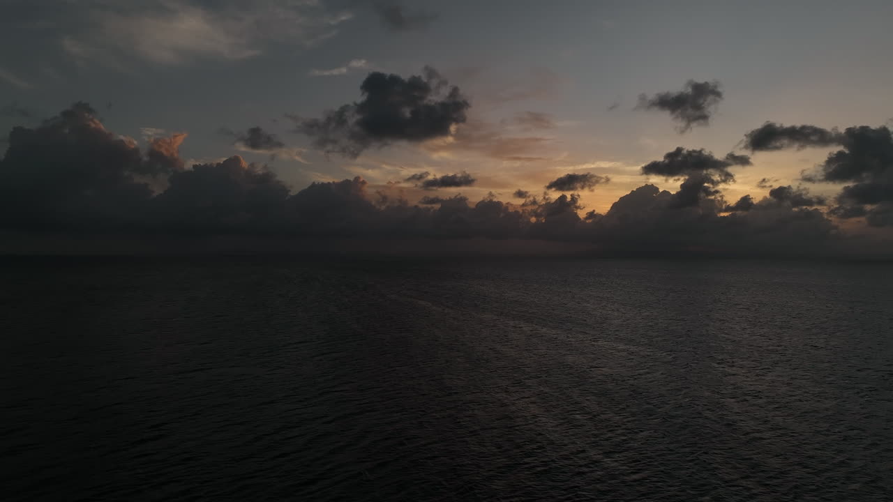 Rising Aerial View Of Caribbean Sunset With Cloudy Skies