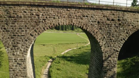 flying above a forest and descending under the chmarocsky viaduct in slovakia