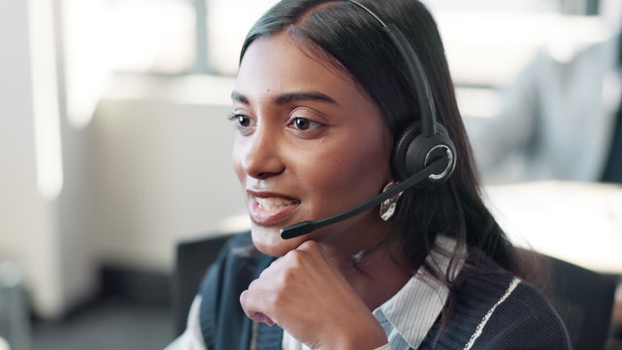 Customer service representative wearing headset in office
