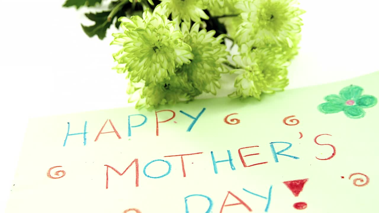 Close-up of happy mothers day card with flowers