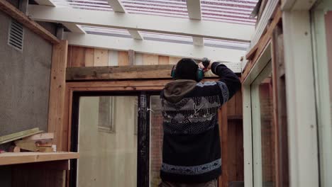 Man-Building-His-DIY-Greenhouse---Close-Up