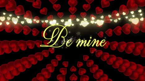 Be-mine-text-with-hearts-appearing-on-black-background