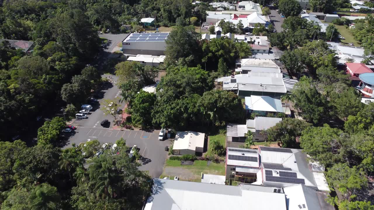 4K Aerial drone shot of a small mountain village surrounded by a rainforest in North Queensland, Australia