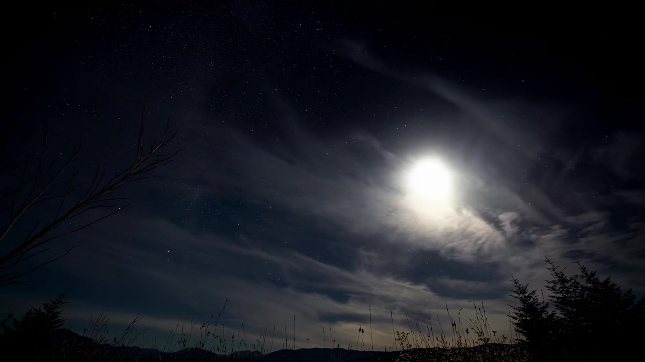 Time Lapse of Full Moon Moving Across Night Sky