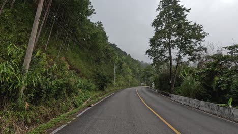 traveling on a winding mountain road with fog