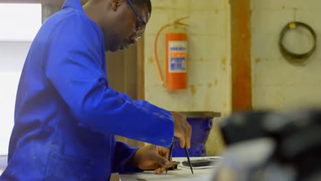 worker working at table in workshop 4k